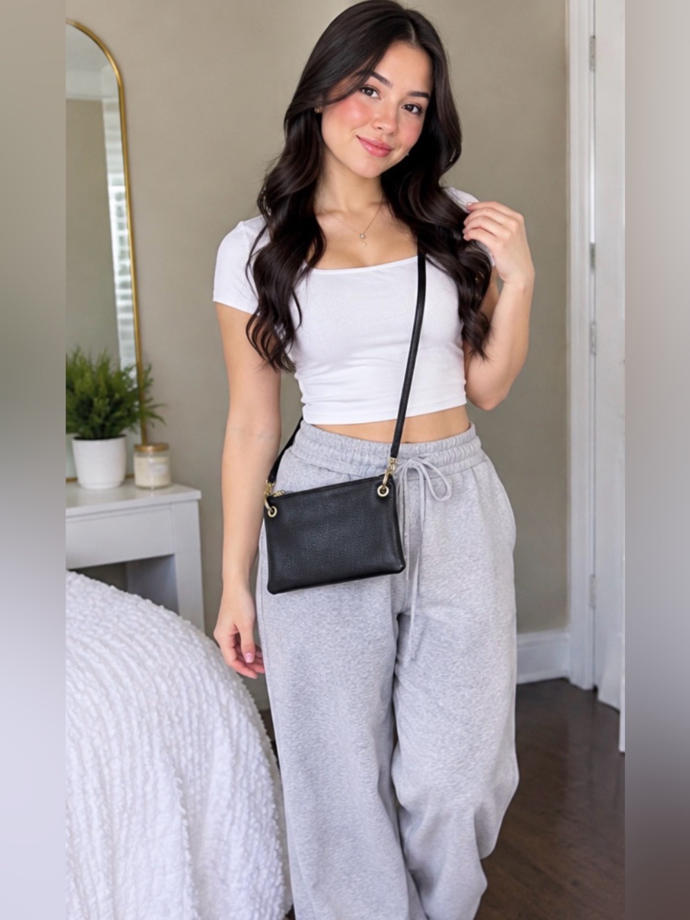 Classic Black Pebbled Leather Crossbody Bag with Gold Rings